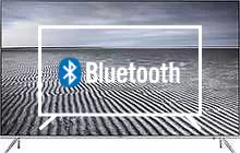 Connectez des haut-parleurs ou des écouteurs Bluetooth au Samsung 49KS7000